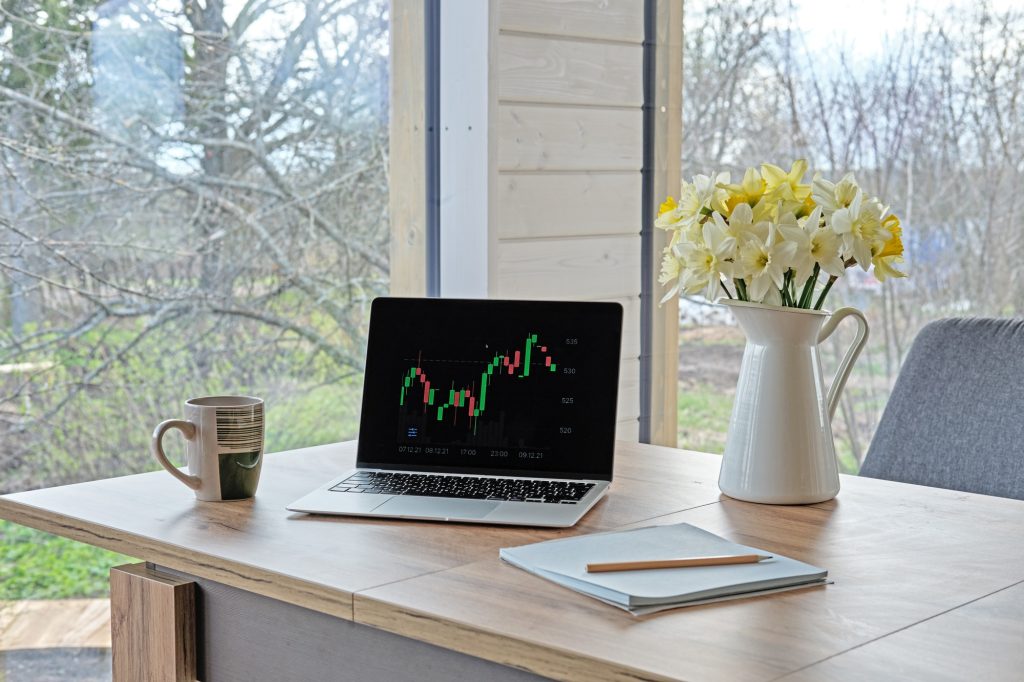 Modern workplace of financial analyst at home. Financial planning.